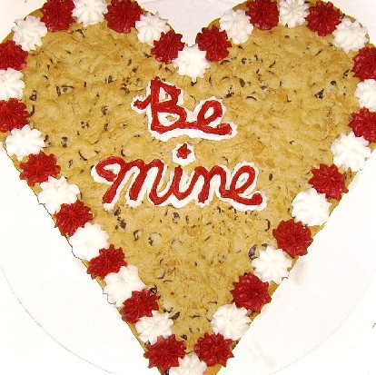 This giant 14" Mrs. Field's® heart shaped chocolate chip cookie cake is 